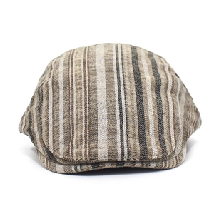 Detailed close-up of earth-toned striped cotton flat cap with retro textured fabric