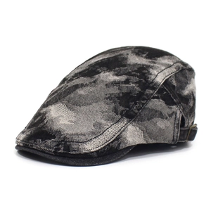 Detailed side view of the washed denim beret featuring a vintage metal adjustable buckle