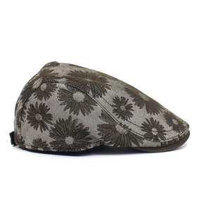 Side view detail of retro cotton newsboy cap with vintage brown daisy floral prints