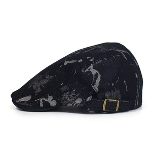 Detailed side view of black printed cotton ivy cap with metal adjustable buckle