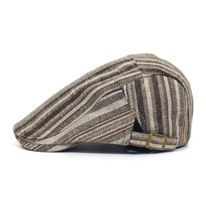 Detail view of the bronze metal adjustable buckle on the striped cotton flat cap