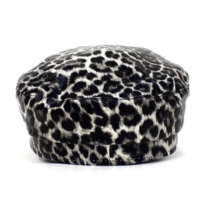 Macro shot of detailed leopard print pattern and fine stitching on the flat top army cap