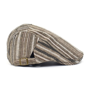 Detail of adjustable metal buckle and striped fabric on a vintage newsboy cap