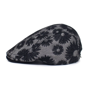 Detailed side view of cotton beret featuring vintage daisy jacquard patterns and short brim