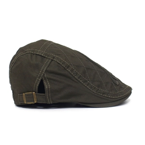 Detailed view of dark olive cotton ivy cap with quilted diamond pattern and metal buckle