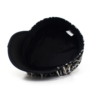 Detail shot of the inner black lining and wash label of a leopard print military hat