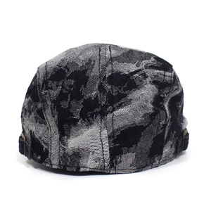 Detailed view of gray ink-style denim beret with adjustable metal buckle on the back