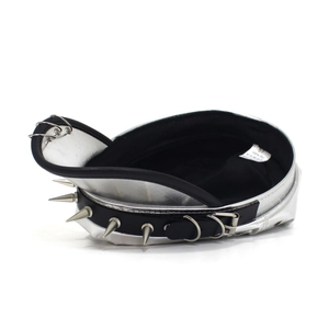 Detail view of silver punk PU leather beret with metal spikes and rings decoration