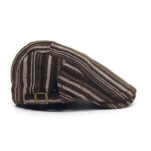 Detail of adjustable bronze buckle on striped cotton beret cap for men and women