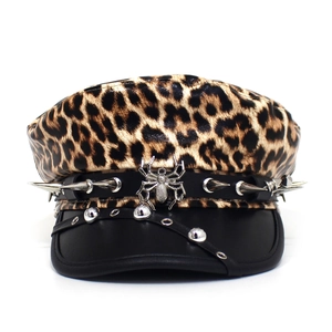 Detail of leopard print military cap with metal spider charm and gothic cone studs
