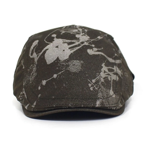 Detailed view of dark cotton ivy cap featuring vintage abstract tie-dye ink patterns