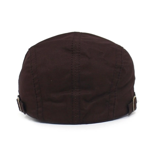 Detail view of the dark brown cotton flat cap showing back seam and adjustable metal buckle
