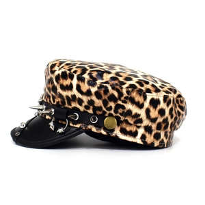 Detailed side view of leopard print captain hat featuring punk metal studs and spikes