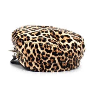 Detail of leopard print military cap featuring silver metal studs and punk rock style accents