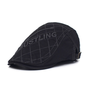 Black cotton beret cap with diamond quilting and Bustling embroidery on white background