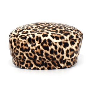 Macro detail of the leopard print faux fur texture on a flat-top navy style captain hat