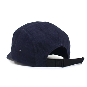 Navy blue five-panel camper cap with adjustable back strap and metal side eyelets