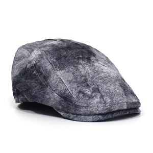 Detail view of marble texture and stitching on a grey vintage flat ivy cap for men