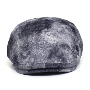 Detailed close-up of dark grey ivy cap featuring vintage tie-dye texture and crinkle effect