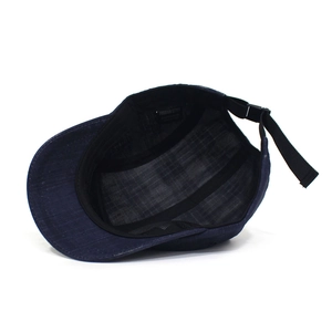 Detail view of the navy denim baseball cap interior showing the sweatband and adjustable strap