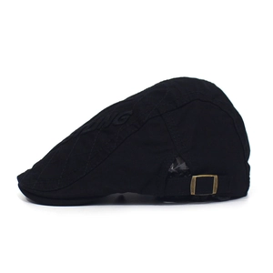 Detail of black cotton beret cap featuring side embossed texture and cooling letters