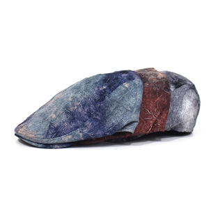Vintage flat caps with crinkle texture and leaf vein print in blue, brown, and white