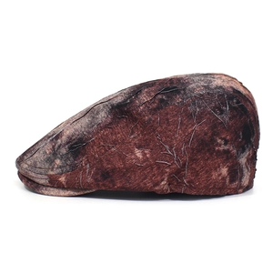 Detailed side view of vintage ivy cap with dark brown textured marble pattern