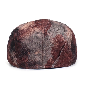 Close-up of textured fabric with leaf vein patterns on a vintage beret flat cap