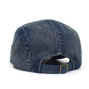 Detail view of the washed denim 5-panel cap featuring an adjustable metal buckle strap