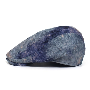 Detailed view of the wrinkled texture and vintage dye pattern on the ivy cap fabric