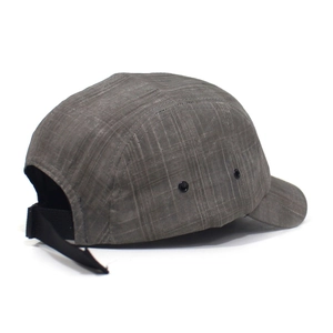 Detail view of grey 5-panel camper hat featuring metal eyelets and ripstop fabric texture