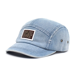 Light blue washed denim baseball cap with five-panel design and metal ring detail