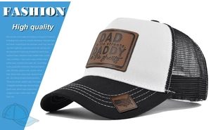 Close-up of leather patch on trucker hat with Dad quote and mesh back detail