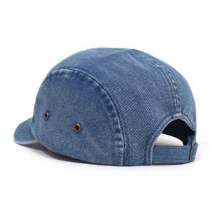 Detail view of denim camper cap with metal eyelets and adjustable back strap