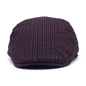 Close-up detail of dark purple plaid textured fabric on the quick-dry beret cap