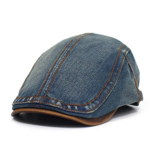 Vintage blue denim flat cap with brown leather brim and contrast stitching details