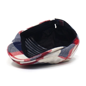 Detail view of colorful plaid ivy cap with metal buckle and premium inner lining