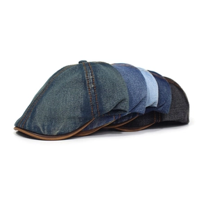 Classic washed denim newsboy cap with contrast stitching and adjustable design for unisex style