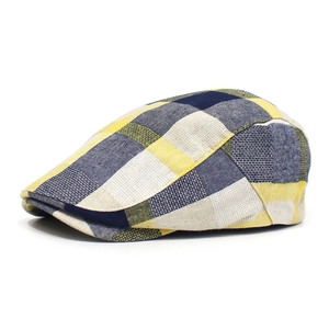 Detail of yellow and blue plaid flat cap with breathable cotton-linen texture