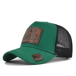 Close-up of leather patch on mesh trucker hat with vintage American flag shield detail