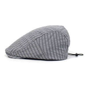 Detail of grey plaid beret cap with adjustable black drawstring for custom sizing