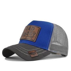 Detail of DAD leather patch and embroidery on two-tone breathable mesh trucker hat