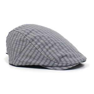Detailed side view of a grey plaid beret hat with adjustable fit and breathable fabric
