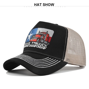 Close-up of Texas truck driving championship embroidery on black and beige mesh cap