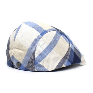 Detail of plaid ivy cap fabric with blue geometric pattern and metal side buckle