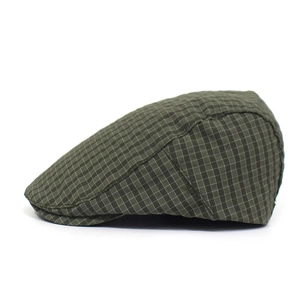Detail of classic dark green plaid pattern on the breathable summer newsboy cap