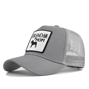 Detail of grey trucker hat featuring Frenchie Mom patch and breathable mesh back