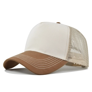 Detail of a brown and cream trucker hat with mesh back and reinforced visor stitching