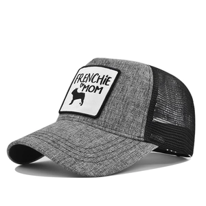 Side view of mesh trucker hat featuring Frenchie Mom embroidery and grey textured fabric