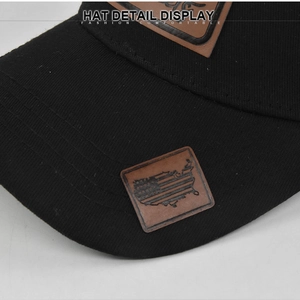 Detail of baseball cap featuring a brown leather patch with embossed US map design
